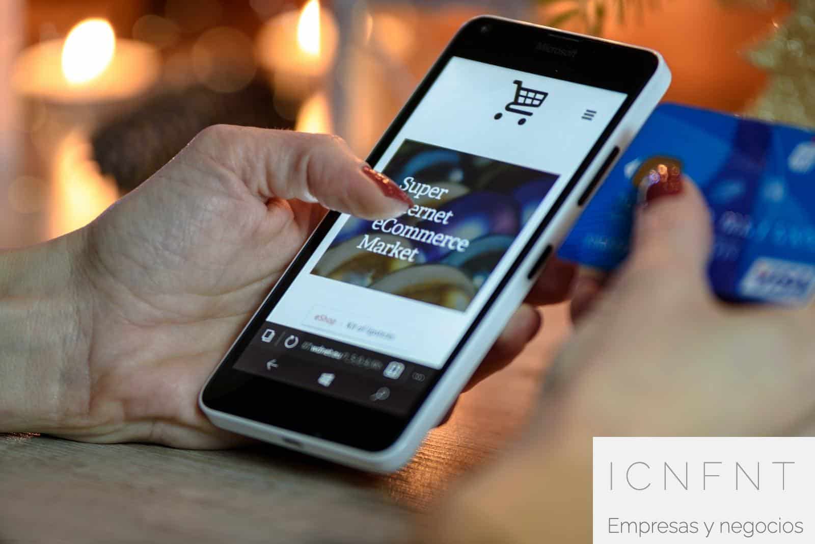 Person Using Black And White Smartphone and Holding Blue Card