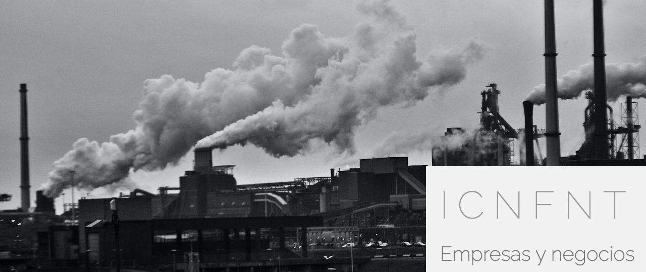 Grayscale Photography of Locomotive Train Beside Factory