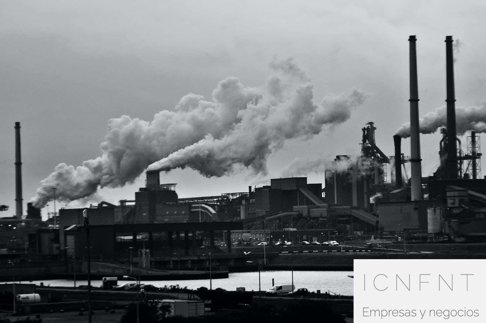 Grayscale Photography of Locomotive Train Beside Factory